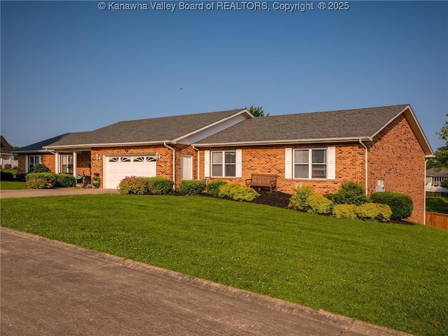 123 Brooke St, Culloden, WV 25510 - ranch-style home with brick siding, a front lawn, an attached garage, and driveway