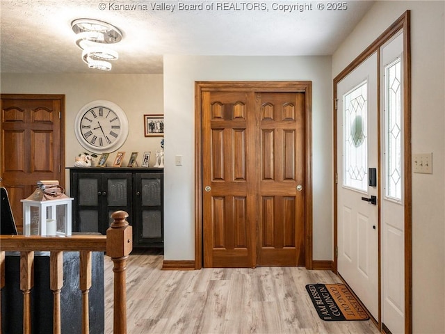 123 Brooke St, Culloden, WV 25510 - foyer entrance with wood finished floors and baseboards