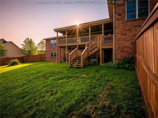 123 Brooke St, Culloden, WV 25510 - back of house featuring brick siding, stairway, and a wooden deck
