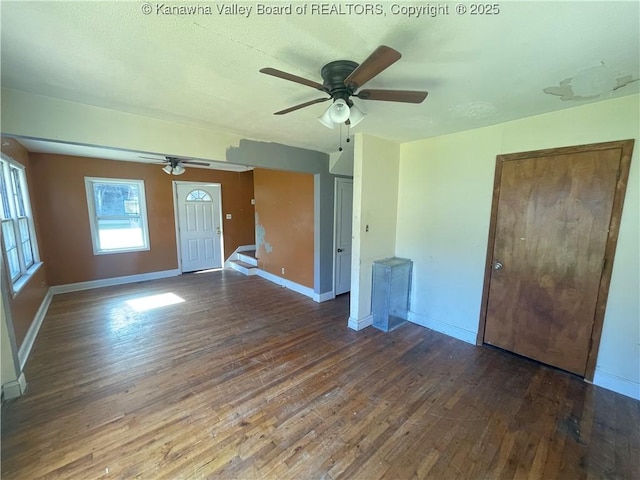 57 Barrett Cir, Wharton, WV 25208 - unfurnished living room with a ceiling fan, hardwood / wood-style floors, and baseboards