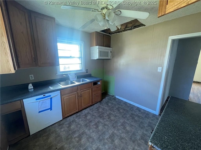 57 Barrett Cir, Wharton, WV 25208 - kitchen with white appliances, a sink, ceiling fan, a textured ceiling, and dark countertops