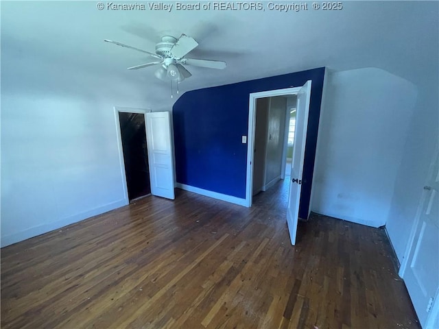 57 Barrett Cir, Wharton, WV 25208 - unfurnished room featuring dark wood-type flooring, a ceiling fan, and baseboards