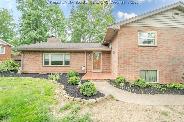868 Alta Rd, Charleston, WV 25314 - view of front of property with brick siding and a chimney
