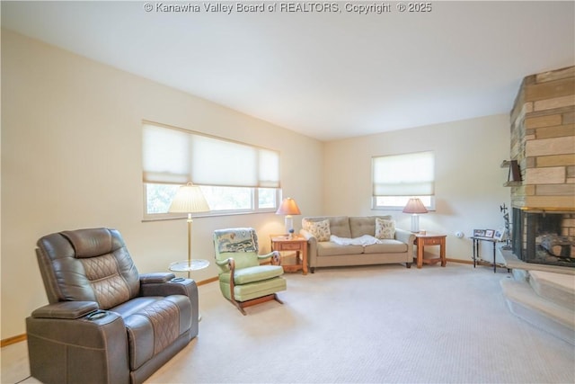 868 Alta Rd, Charleston, WV 25314 - living area featuring plenty of natural light, a stone fireplace, and light carpet
