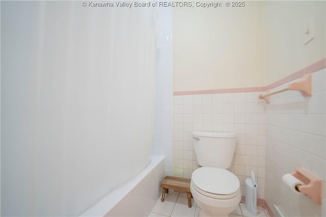 868 Alta Rd, Charleston, WV 25314 - bathroom with toilet, a wainscoted wall, tile walls, shower / bathtub combination with curtain, and tile patterned floors