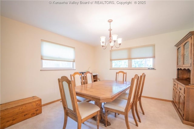 868 Alta Rd, Charleston, WV 25314 - dining space with a chandelier, light colored carpet, and baseboards