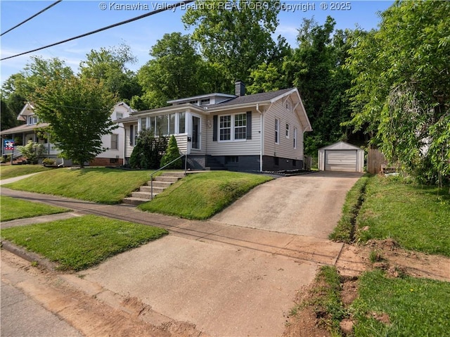 2116 21st St, Nitro, WV 25143 - view of front of house featuring an outbuilding, a garage, driveway, a front lawn, and a chimney