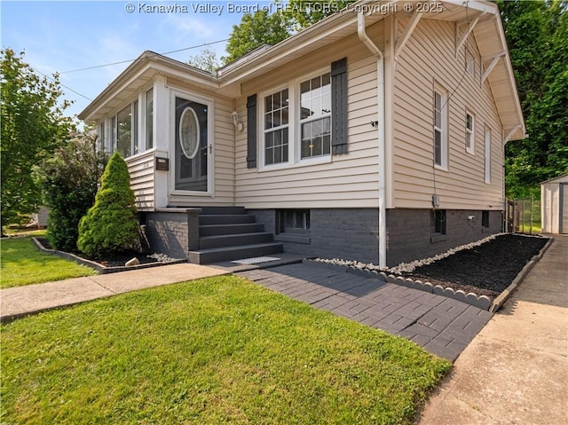 2116 21st St, Nitro, WV 25143 - view of front facade with a front lawn