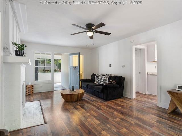 2116 21st St, Nitro, WV 25143 - living area featuring dark wood finished floors, a ceiling fan, and baseboards