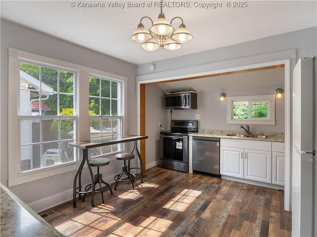 2116 21st St, Nitro, WV 25143 - kitchen with appliances with stainless steel finishes, a sink, dark wood-style floors, and plenty of natural light