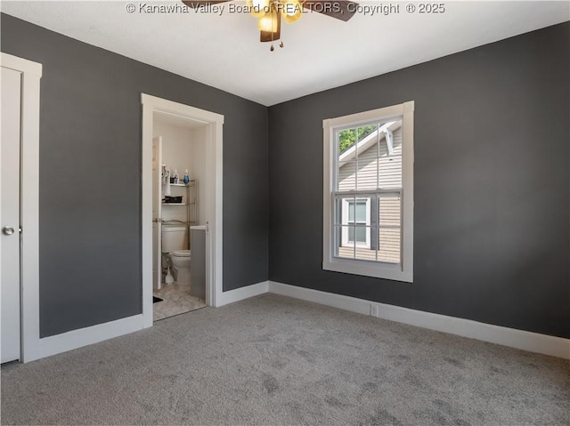 2116 21st St, Nitro, WV 25143 - empty room featuring carpet flooring, a ceiling fan, and baseboards