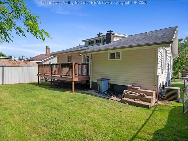 2116 21st St, Nitro, WV 25143 - back of house featuring cooling unit, a yard, a wooden deck, and a shingled roof