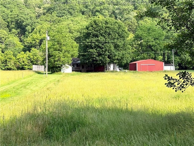3112 Cicerone Rd, Charleston, WV 25320 - view of yard with an outbuilding, a garage, and a forest view