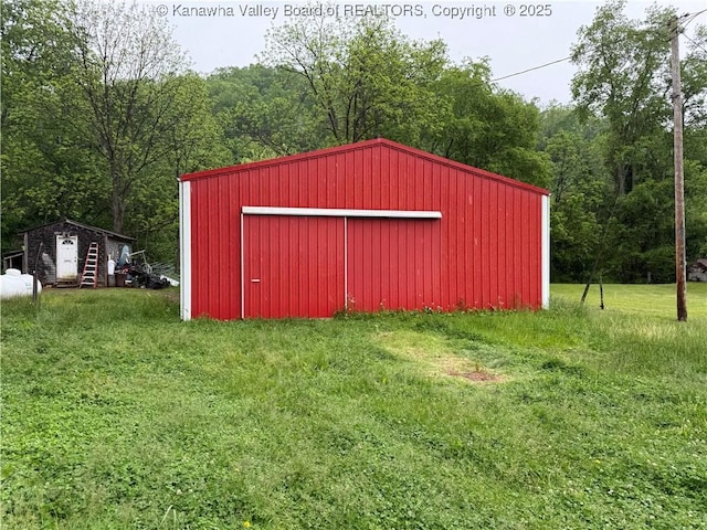 3112 Cicerone Rd, Charleston, WV 25320 - view of pole building with a yard and a forest view