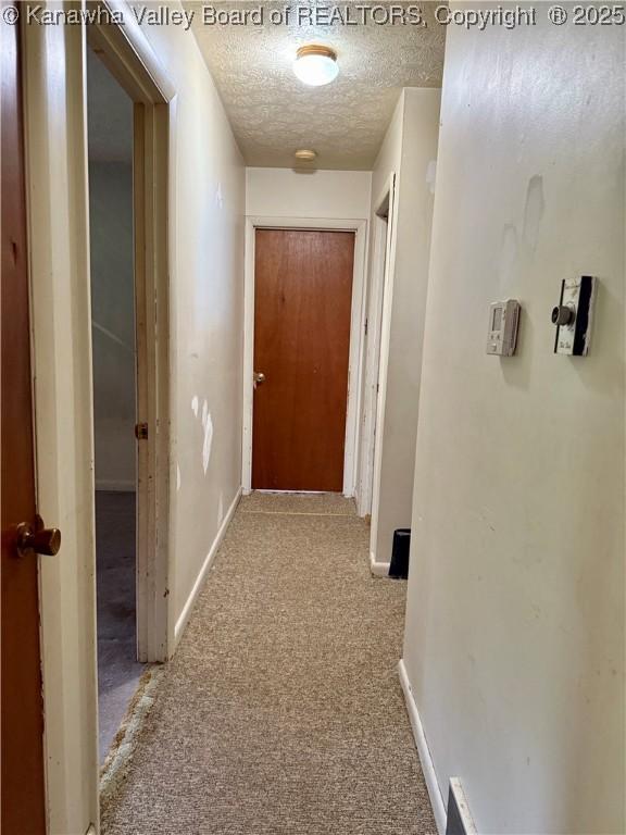 3112 Cicerone Rd, Charleston, WV 25320 - hallway with carpet, a textured ceiling, and baseboards