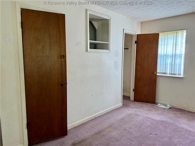 3112 Cicerone Rd, Charleston, WV 25320 - unfurnished bedroom featuring carpet floors, baseboards, and a textured ceiling