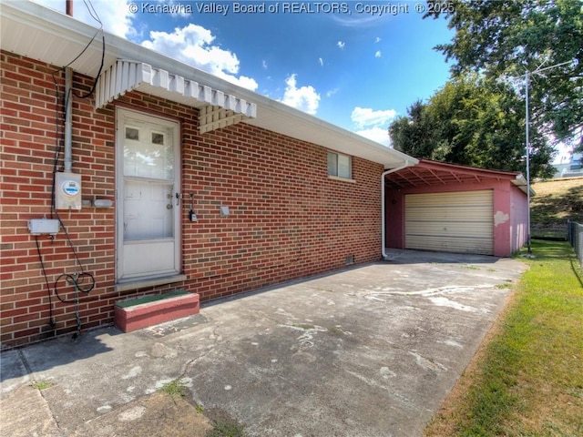 1911 Washington Ave, Saint Albans, WV 25177 - doorway to property with brick siding, driveway, and an attached garage