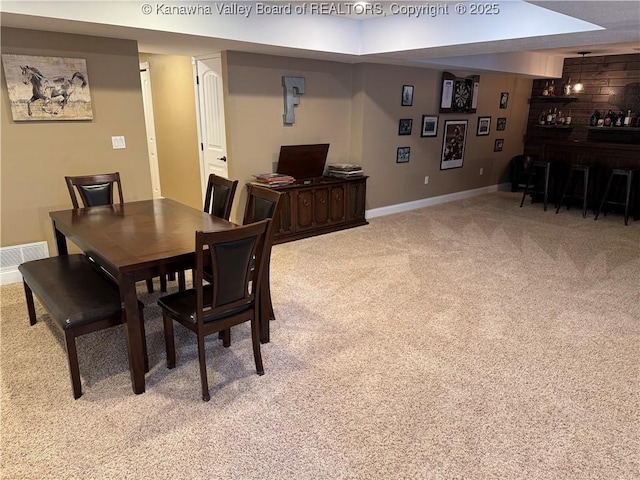 90 Brooke St, Culloden, WV 25510 - dining room featuring carpet flooring, baseboards, and bar