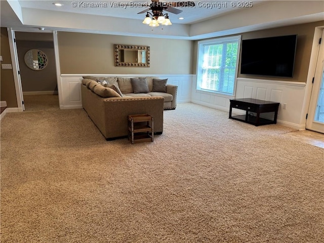 90 Brooke St, Culloden, WV 25510 - carpeted living room with a raised ceiling, a ceiling fan, wainscoting, recessed lighting, and a decorative wall