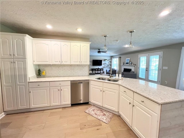 90 Brooke St, Culloden, WV 25510 - kitchen featuring stainless steel dishwasher, ceiling fan, a peninsula, a sink, and backsplash