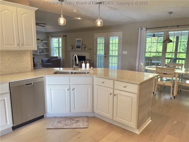 90 Brooke St, Culloden, WV 25510 - kitchen with dishwasher, a sink, light wood-style floors, a peninsula, and decorative light fixtures