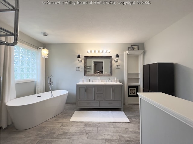 90 Brooke St, Culloden, WV 25510 - full bathroom featuring a freestanding tub and double vanity
