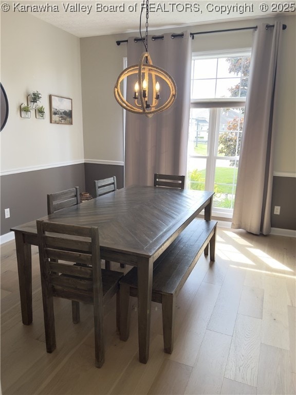 90 Brooke St, Culloden, WV 25510 - dining space with a chandelier, light wood-style floors, and baseboards