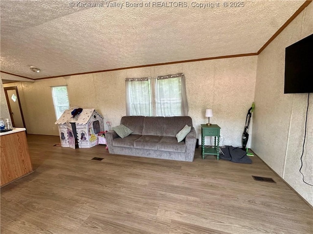 80 Restful Haven Dr, Logan, WV 25601 - living area with ornamental molding, a textured ceiling, a textured wall, and wood finished floors