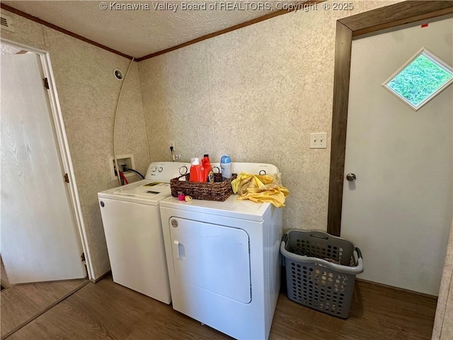 80 Restful Haven Dr, Logan, WV 25601 - washroom with crown molding, independent washer and dryer, wood finished floors, and a textured ceiling