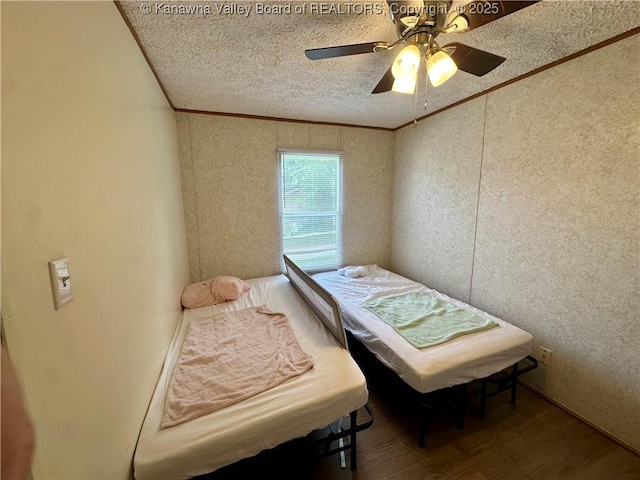 80 Restful Haven Dr, Logan, WV 25601 - bedroom with ornamental molding, wood finished floors, ceiling fan, and a textured ceiling