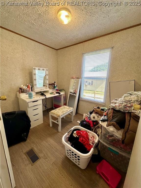 80 Restful Haven Dr, Logan, WV 25601 - office area with wood finished floors, a textured ceiling, and ornamental molding