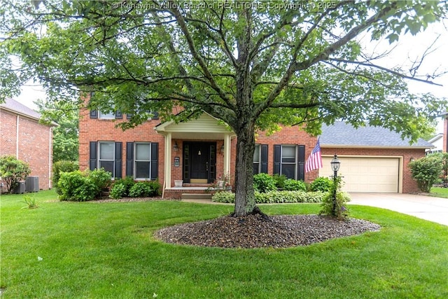 112 Willowood Cir, Hurricane, WV 25526 - view of front facade with brick siding, driveway, and central AC unit