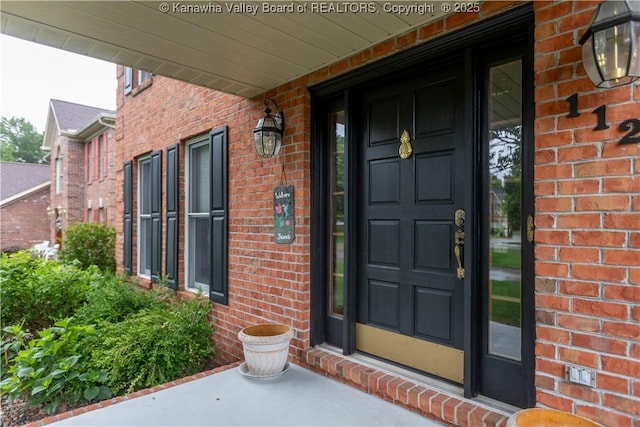 112 Willowood Cir, Hurricane, WV 25526 - view of exterior entry with brick siding and a porch