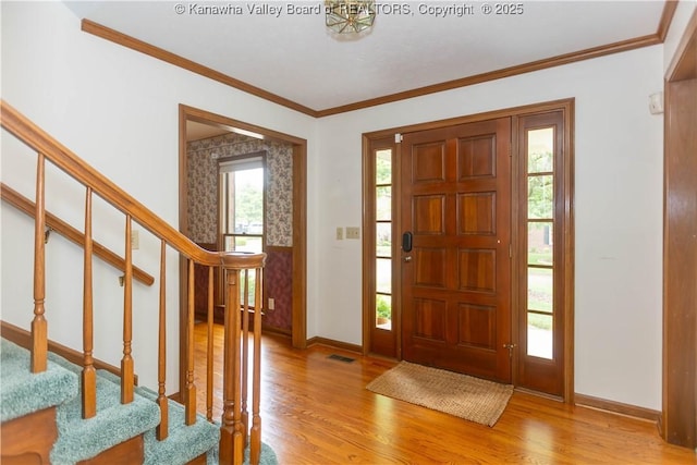 112 Willowood Cir, Hurricane, WV 25526 - foyer entrance featuring light wood-style floors, stairway, baseboards, and ornamental molding
