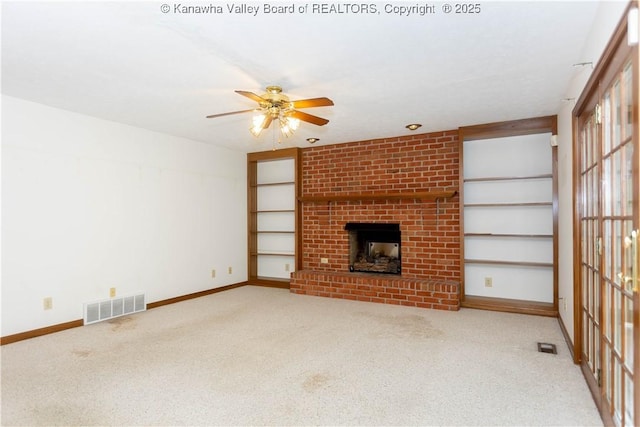 112 Willowood Cir, Hurricane, WV 25526 - unfurnished living room featuring carpet, a ceiling fan, baseboards, a brick fireplace, and built in features