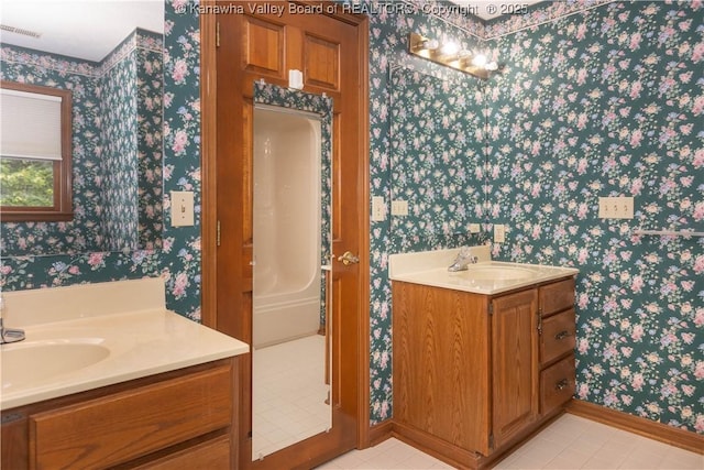 112 Willowood Cir, Hurricane, WV 25526 - full bath with wallpapered walls, vanity, baseboards, and tile patterned flooring