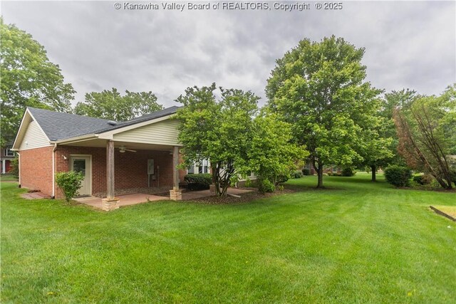 112 Willowood Cir, Hurricane, WV 25526 - view of green lawn with ceiling fan and a patio