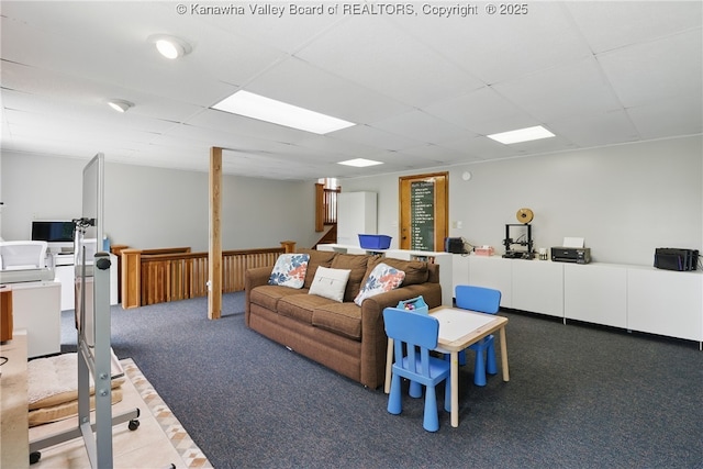3021 Sansom Ct, Milton, WV 25541 - carpeted living area featuring a drop ceiling and washer / dryer