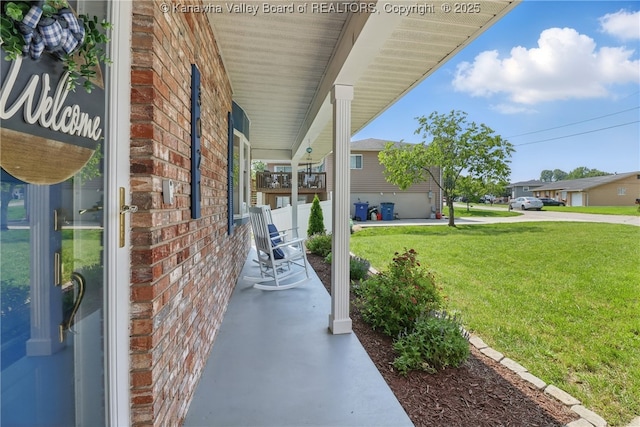 3021 Sansom Ct, Milton, WV 25541 - porch featuring a lawn