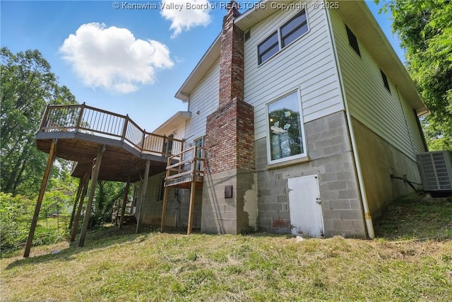 3021 Sansom Ct, Milton, WV 25541 - back of house featuring a deck, a chimney, cooling unit, and a yard