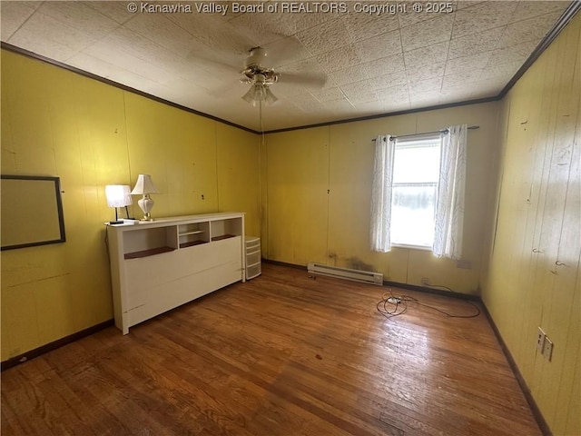 386 Maple St, Mason, WV 25260 - unfurnished bedroom with baseboard heating, crown molding, wood finished floors, and ceiling fan