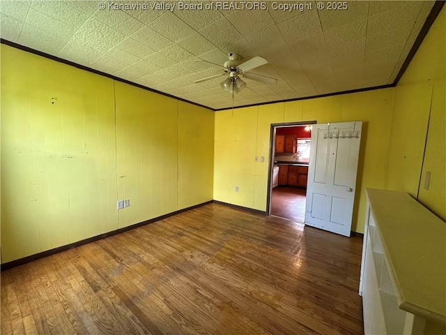 386 Maple St, Mason, WV 25260 - unfurnished room featuring dark wood finished floors, ornamental molding, ceiling fan, and baseboards