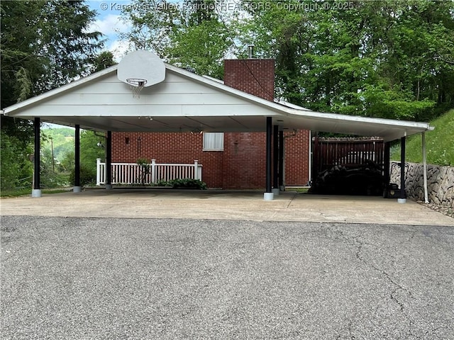 424 Porter Rd, Charleston, WV 25314 - view of front of home featuring brick siding, asphalt driveway, a chimney, and a carport