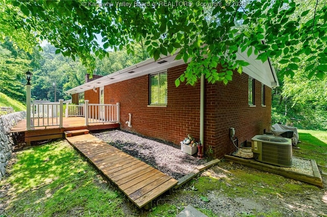 424 Porter Rd, Charleston, WV 25314 - back of property with brick siding, central air condition unit, and a wooden deck