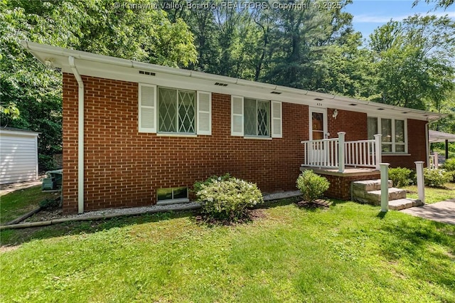 424 Porter Rd, Charleston, WV 25314 - ranch-style home with a front yard and brick siding