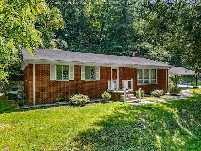 424 Porter Rd, Charleston, WV 25314 - view of front facade featuring brick siding and a front yard