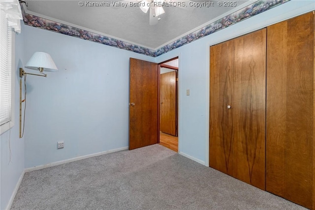 424 Porter Rd, Charleston, WV 25314 - unfurnished bedroom featuring carpet, a closet, ornamental molding, ceiling fan, and baseboards