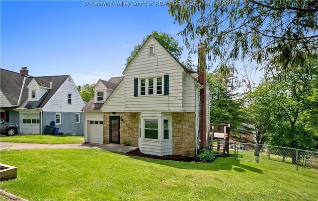 1539 Clark Rd, Charleston, WV 25314 - view of front facade featuring stone siding, an attached garage, and driveway