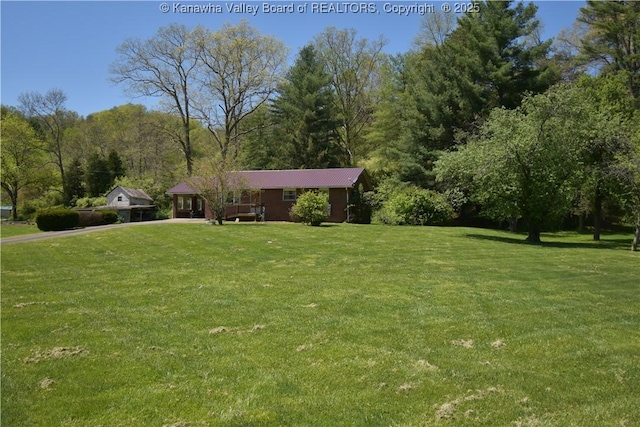 6 Coast Run Rd, Sandyville, WV 25275 - view of front of house featuring a front lawn, driveway, and a view of trees