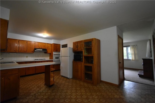 6 Coast Run Rd, Sandyville, WV 25275 - kitchen with white appliances, brown cabinetry, light countertops, ventilation hood, and backsplash